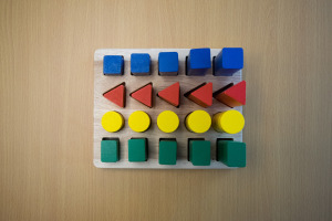 Colorful blocks of varying sizes encourage hand-eye coordination to match the shapes!